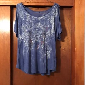 Cow skull printed shirt.